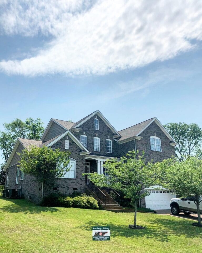 Shingle roof on a stone and brick home