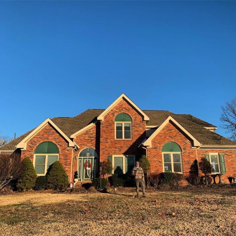 Finished shingle roof on a brick home