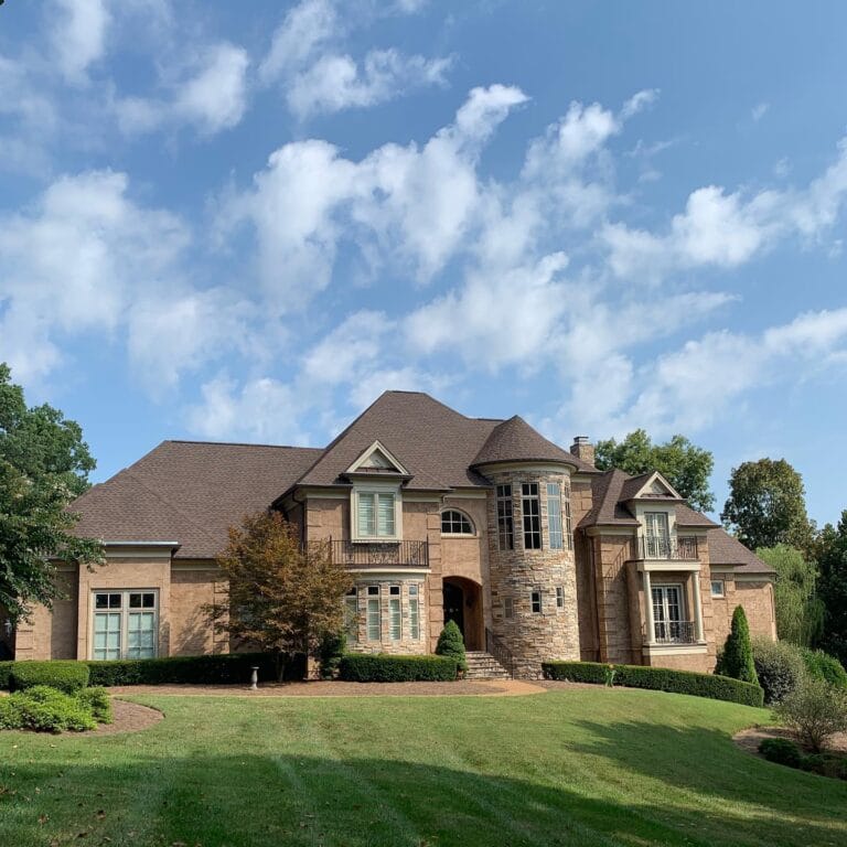 Shingle roof replacement on a stone home