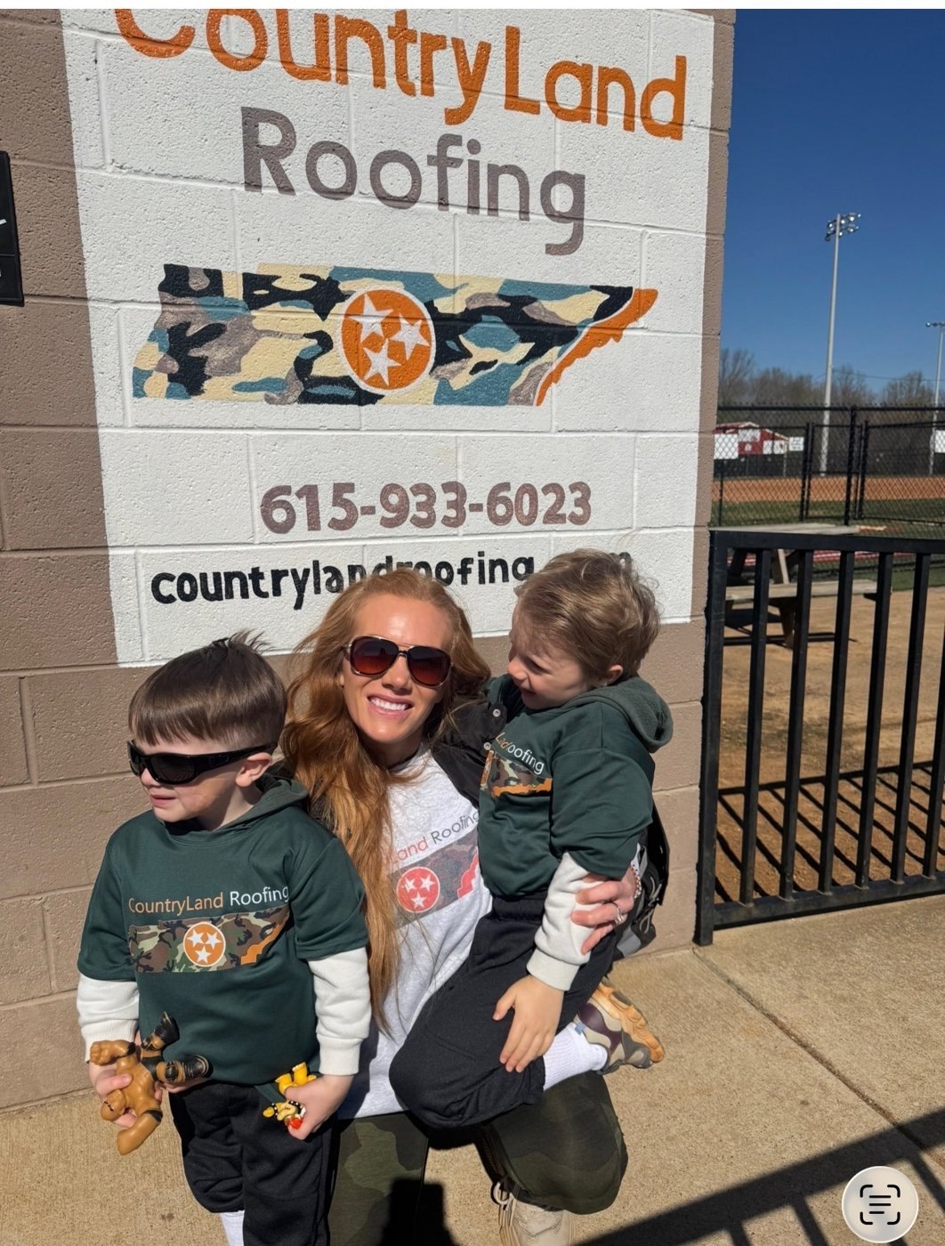CountryLand Roofing logo painted at the Charlotte TN ballfield
