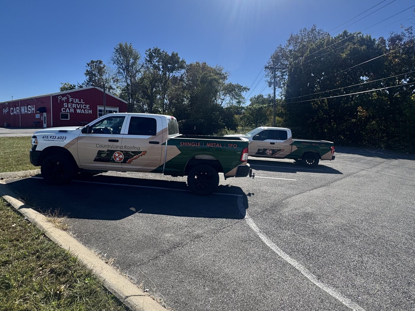 CountryLand Roofing trucks parked at the Dickson TN office